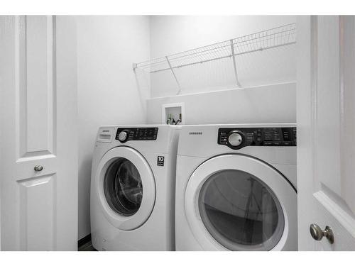 144 Evansborough Crescent Nw, Calgary, AB - Indoor Photo Showing Laundry Room