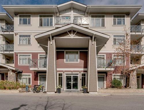 304-28 Auburn Bay Link Se, Calgary, AB - Outdoor With Balcony With Facade