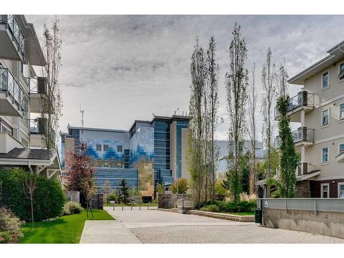 304-28 Auburn Bay Link Se, Calgary, AB - Outdoor With Balcony With Facade