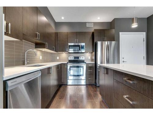 304-28 Auburn Bay Link Se, Calgary, AB - Indoor Photo Showing Kitchen With Stainless Steel Kitchen With Upgraded Kitchen