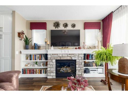 16 Emberside Green, Cochrane, AB - Indoor Photo Showing Living Room With Fireplace