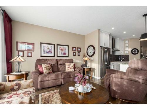 16 Emberside Green, Cochrane, AB - Indoor Photo Showing Living Room