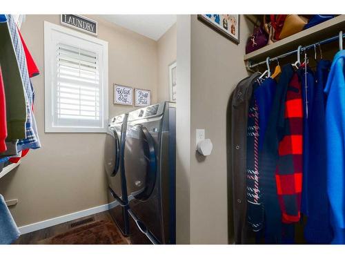 16 Emberside Green, Cochrane, AB - Indoor Photo Showing Laundry Room