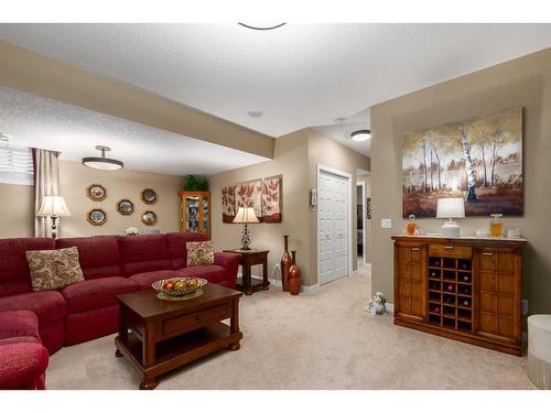 16 Emberside Green, Cochrane, AB - Indoor Photo Showing Living Room