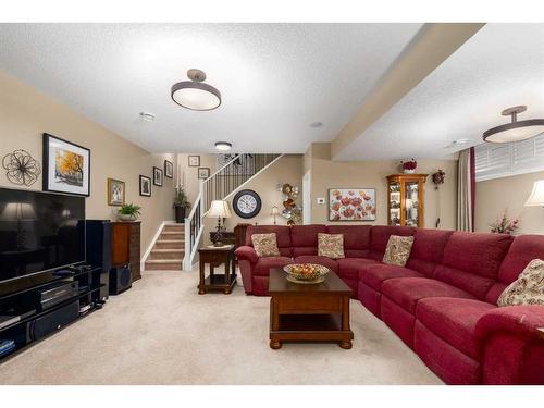 16 Emberside Green, Cochrane, AB - Indoor Photo Showing Living Room