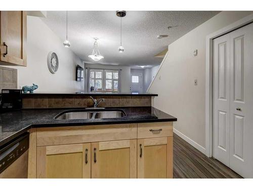 104-201 Muskrat Street, Banff, AB - Indoor Photo Showing Kitchen With Double Sink