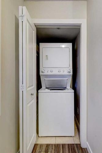 104-201 Muskrat Street, Banff, AB - Indoor Photo Showing Laundry Room