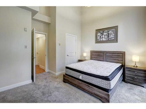 104-201 Muskrat Street, Banff, AB - Indoor Photo Showing Bedroom