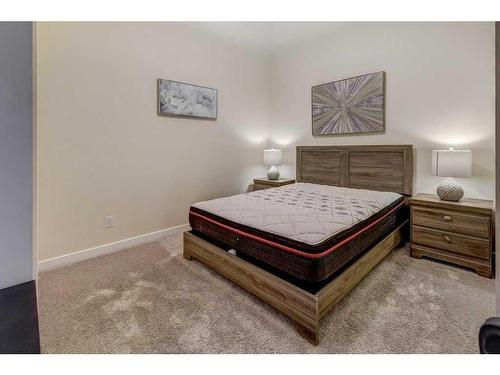 104-201 Muskrat Street, Banff, AB - Indoor Photo Showing Bedroom