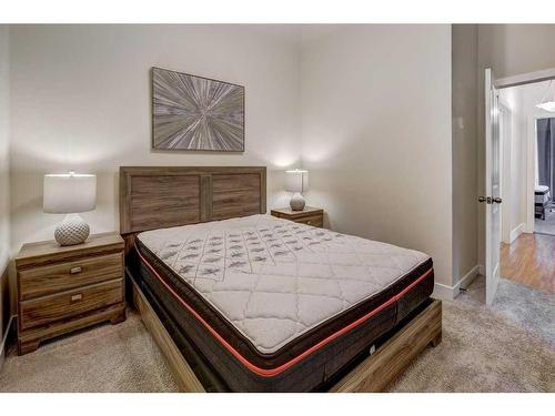 104-201 Muskrat Street, Banff, AB - Indoor Photo Showing Bedroom