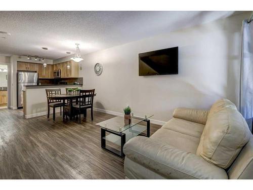 104-201 Muskrat Street, Banff, AB - Indoor Photo Showing Living Room