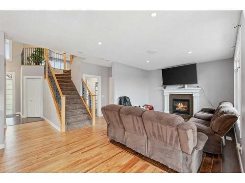 124 Willowmere Way Nw, Chestermere, AB - Indoor Photo Showing Living Room With Fireplace