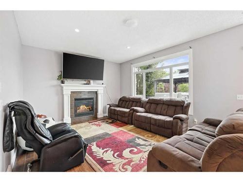 124 Willowmere Way Nw, Chestermere, AB - Indoor Photo Showing Living Room With Fireplace