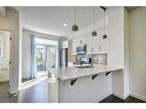 164 Walden Path Se, Calgary, AB - Indoor Photo Showing Kitchen With Double Sink With Upgraded Kitchen