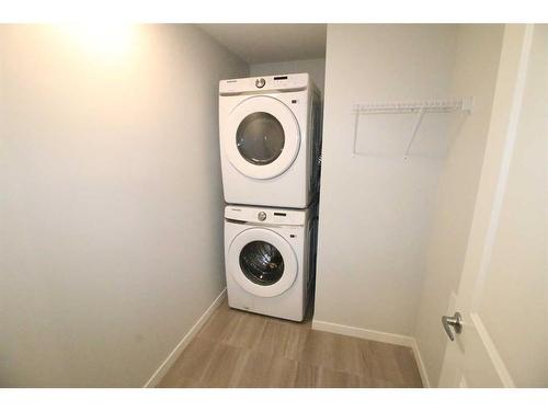 111-360 Harvest Hills Way Ne, Calgary, AB - Indoor Photo Showing Laundry Room