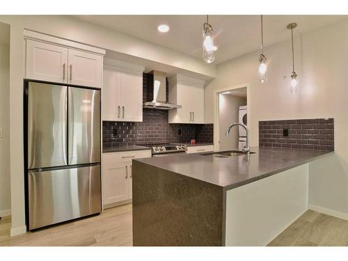 111-360 Harvest Hills Way Ne, Calgary, AB - Indoor Photo Showing Kitchen With Upgraded Kitchen