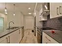 111-360 Harvest Hills Way Ne, Calgary, AB  - Indoor Photo Showing Kitchen With Double Sink With Upgraded Kitchen 