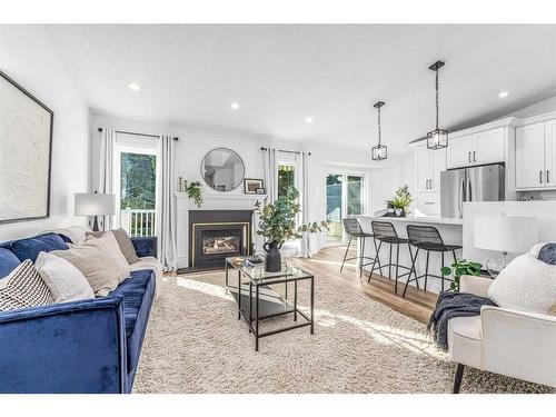 119 Gladstone Gardens Sw, Calgary, AB - Indoor Photo Showing Living Room With Fireplace