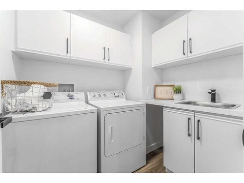 119 Gladstone Gardens Sw, Calgary, AB - Indoor Photo Showing Laundry Room