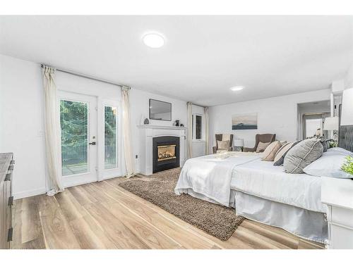 119 Gladstone Gardens Sw, Calgary, AB - Indoor Photo Showing Bedroom With Fireplace