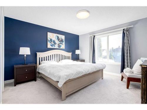 141 Cougar Ridge Circle Sw, Calgary, AB - Indoor Photo Showing Bedroom