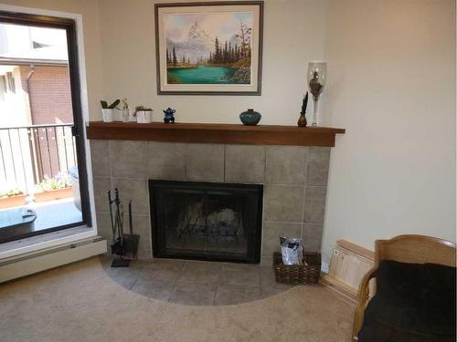 1306-13045 6 Street Sw, Calgary, AB - Indoor Photo Showing Living Room With Fireplace