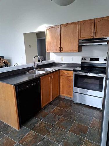 3 Alberta Avenue, Okotoks, AB - Indoor Photo Showing Kitchen With Double Sink