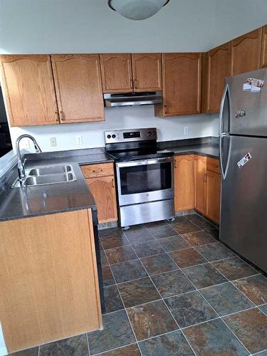 3 Alberta Avenue, Okotoks, AB - Indoor Photo Showing Kitchen With Double Sink