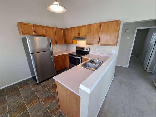 3 Alberta Avenue, Okotoks, AB - Indoor Photo Showing Kitchen With Double Sink