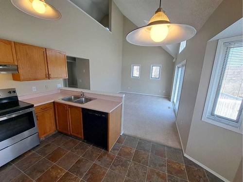 3 Alberta Avenue, Okotoks, AB - Indoor Photo Showing Kitchen With Double Sink