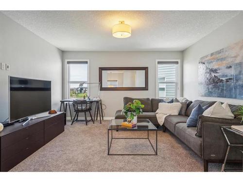 53 Sundown Grove, Cochrane, AB - Indoor Photo Showing Living Room