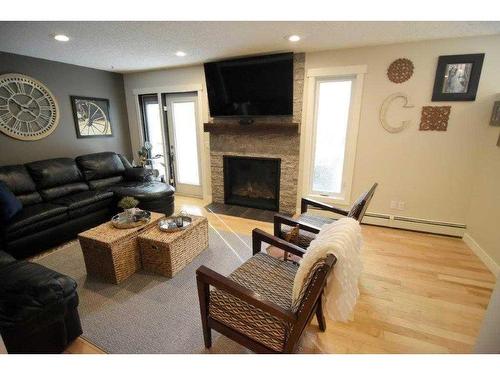 50 Parkwood Crescent, Strathmore, AB - Indoor Photo Showing Living Room With Fireplace