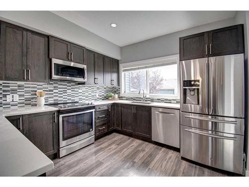 590 Hillcrest Road Sw, Airdrie, AB - Indoor Photo Showing Kitchen With Stainless Steel Kitchen With Upgraded Kitchen