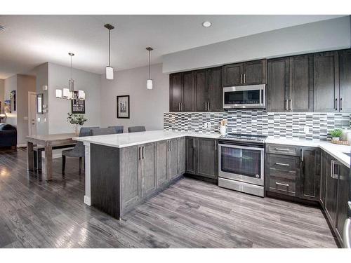 590 Hillcrest Road Sw, Airdrie, AB - Indoor Photo Showing Kitchen With Stainless Steel Kitchen With Upgraded Kitchen