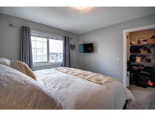 590 Hillcrest Road Sw, Airdrie, AB - Indoor Photo Showing Bedroom