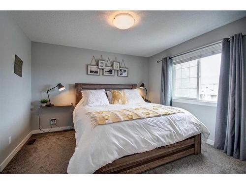 590 Hillcrest Road Sw, Airdrie, AB - Indoor Photo Showing Bedroom