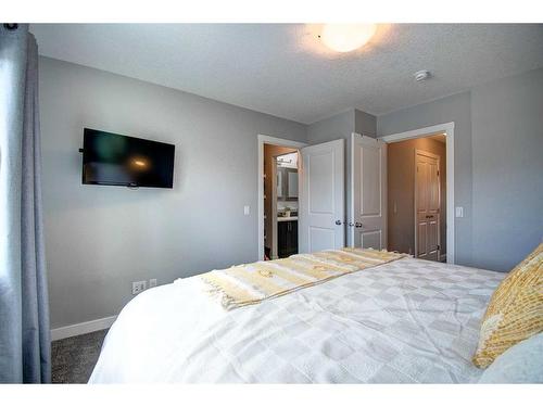 590 Hillcrest Road Sw, Airdrie, AB - Indoor Photo Showing Bedroom