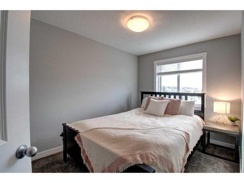 590 Hillcrest Road Sw, Airdrie, AB - Indoor Photo Showing Bedroom