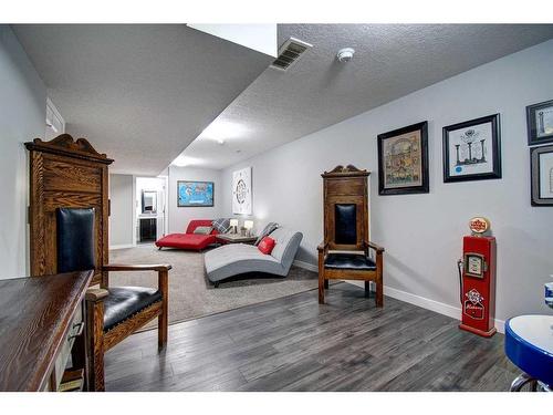 590 Hillcrest Road Sw, Airdrie, AB - Indoor Photo Showing Other Room With Fireplace