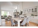 14 West Hall Place, Cochrane, AB  - Indoor Photo Showing Dining Room With Fireplace 