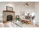 14 West Hall Place, Cochrane, AB  - Indoor Photo Showing Living Room With Fireplace 