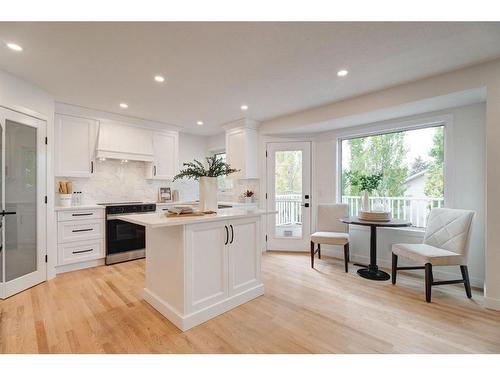 14 West Hall Place, Cochrane, AB - Indoor Photo Showing Kitchen With Upgraded Kitchen