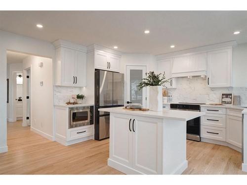 14 West Hall Place, Cochrane, AB - Indoor Photo Showing Kitchen With Stainless Steel Kitchen With Upgraded Kitchen