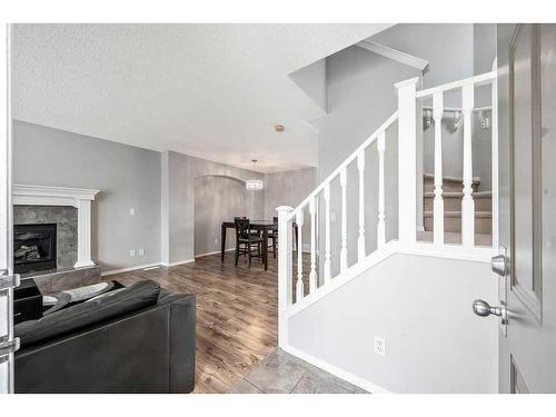 198 Cranberry Close Se, Calgary, AB - Indoor With Fireplace