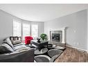 198 Cranberry Close Se, Calgary, AB  - Indoor Photo Showing Living Room With Fireplace 