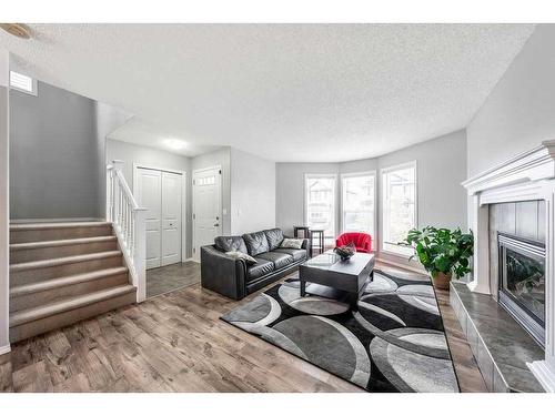 198 Cranberry Close Se, Calgary, AB - Indoor Photo Showing Living Room With Fireplace