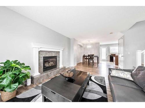 198 Cranberry Close Se, Calgary, AB - Indoor Photo Showing Living Room With Fireplace