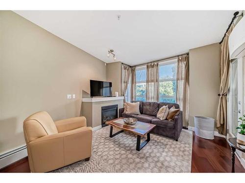 324-315 24 Avenue Sw, Calgary, AB - Indoor Photo Showing Living Room With Fireplace