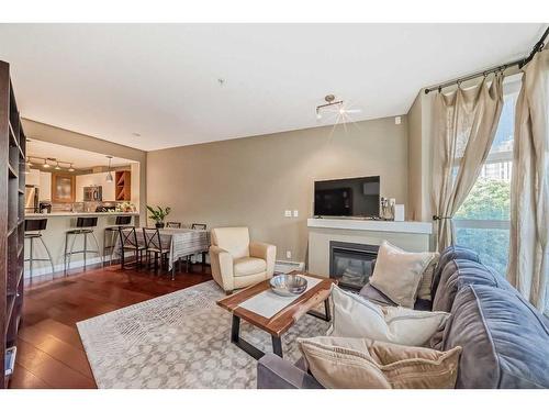 324-315 24 Avenue Sw, Calgary, AB - Indoor Photo Showing Living Room With Fireplace