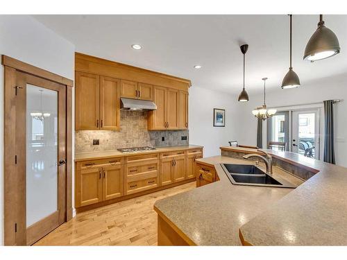 164 Kinniburgh Boulevard, Chestermere, AB - Indoor Photo Showing Kitchen With Double Sink